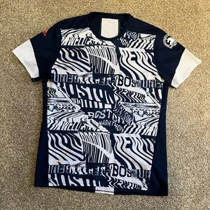 Boston marathon shirt.